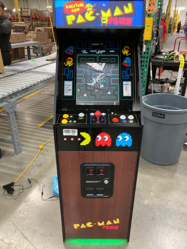 Photo 2 of Arcade1Up PAC-Man Plus Deluxe Arcade Machine - 14 Classic Games, Retro Game Console for Home, 5’ Tall Cabinet with 17-Inch Screen, Stand Up Video Game for Game Room
***SCREEN HAS LEFT OVER STICKER RESIDUE***