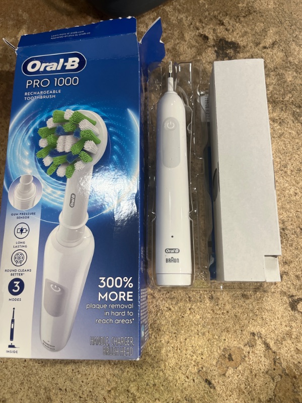 Photo 2 of **MISSING BRUSH HEAD**
Oral-B Pro 1000 Rechargeable Electric Toothbrush, White