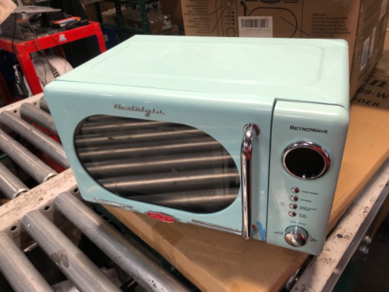 Photo 6 of ***NONREFUNDABLE - THIS SALE FINAL - MAJOR DAMAGE - SEE COMMENTS***
Nostalgia Retro Compact Countertop Microwave Oven - 0.7 Cu. Ft. - 700-Watts with LED Digital Display - Child Lock - Easy Clean Interior - Aqua