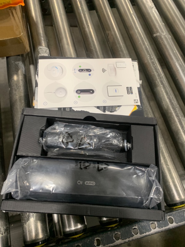 Photo 1 of Oral-B iO Series 10 Rechargeable Electric Toothbrush with Visible Pressure Sensor to Protect Gums, 2 Min Timer, 7 Cleaning Settings, 4 Replacement Toothbrush Heads, and Charging Travel Case, White Black 1 Count (Pack of 1)