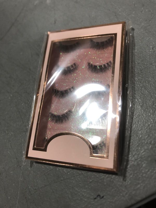 Photo 2 of DIKAYI TM24 False Eyelashes Pack includes 5 pairs of soft and wispy Clear Band lashes that enhance the natural beauty of your eyes with a subtle, natural look.