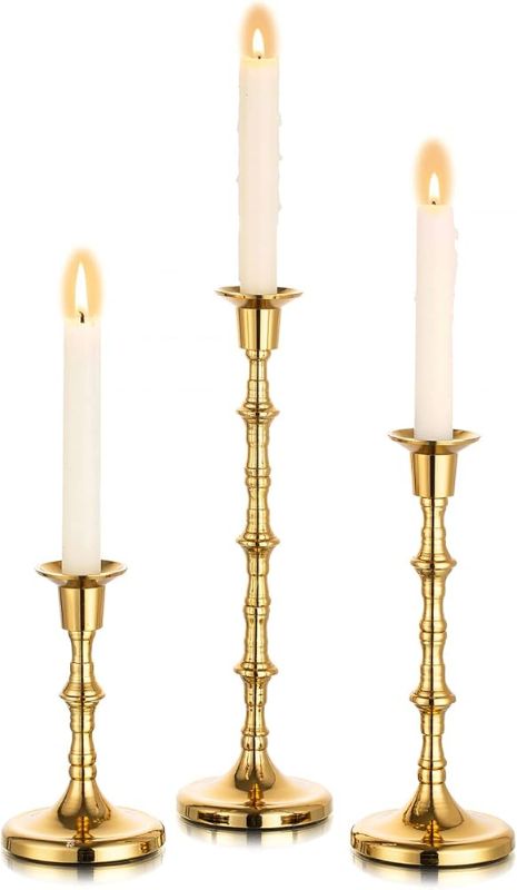 Photo 1 of  Nuptio Gold Candle Holders Taper Candlestick Holders Tall Thin Candle Sticks Candleholders Modern Metal Candle Holder for Wedding Gift Housewarming Gift Friendship Gifts Set of 3 