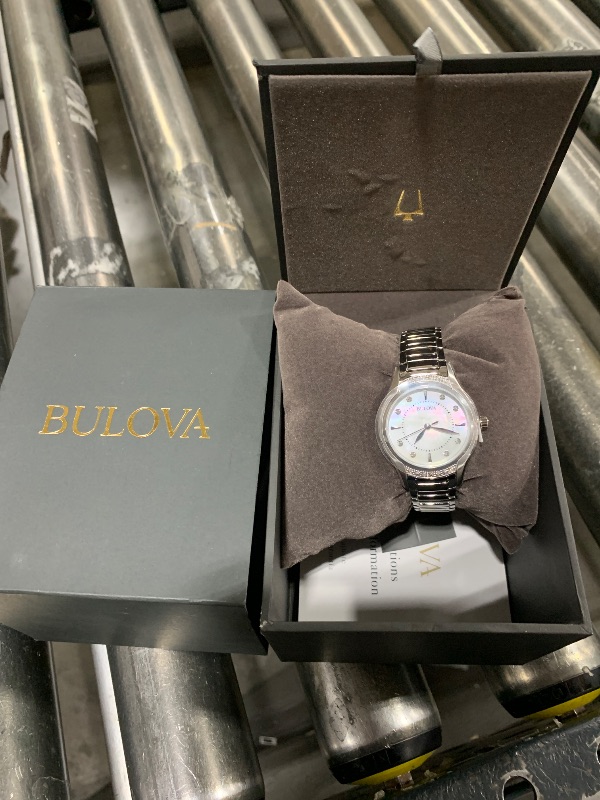 Photo 2 of Bulova Ladies' Classic Diamond 3-Hand Quartz Stainless Steel Watch, 16 Diamonds, Mother-of-Pearl Dial, Curved Mineral Crystal, Silver Tone