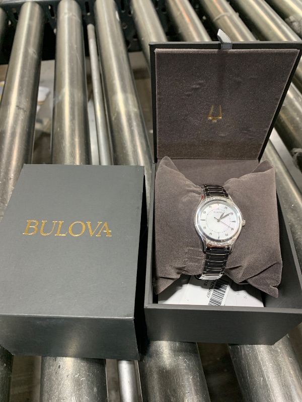 Photo 2 of Bulova Ladies' Classic Diamond 3-Hand Quartz Stainless Steel Watch, 16 Diamonds, Mother-of-Pearl Dial, Curved Mineral Crystal, Silver Tone