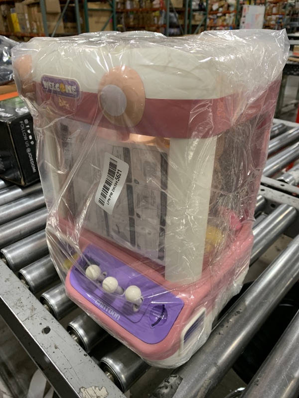 Photo 1 of Jovow Claw Machine for Kids, Mini Vending Machine with Music, Prize Dispenser Toys for Girls and Boys, Electronic Claw Game Machine for Party Birthdays, Includes 45 Mini Toys (Large)