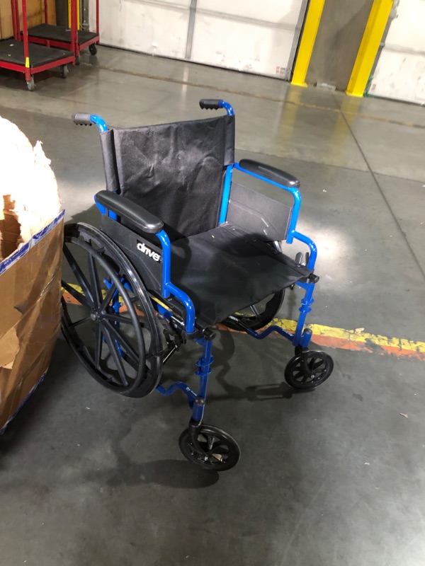 Photo 2 of ***USED - NO PACKAGING - MISSING LEG RESTS - SEE PICTURES***
Blue Streak Wheelchair with Flip Back Desk Arms, Elevating Leg Rests 20" Seat