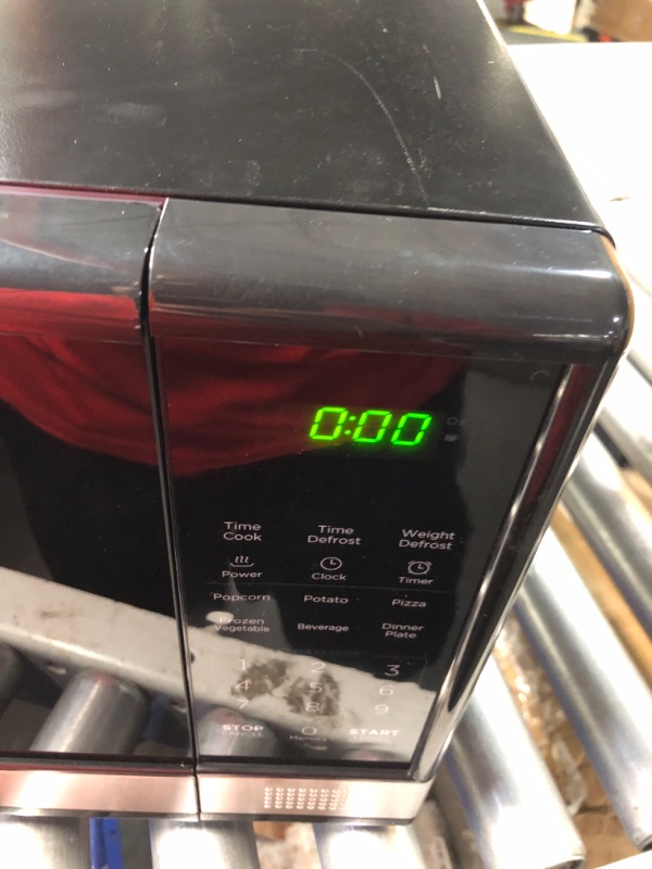 Photo 9 of ***USED - SCRATCHED AND DIRTY - LIKELY MISSING PARTS - UNABLE TO VERIFY FUNCTIONALITY - SEE PICTURES***
BLACK+DECKER EM031MB11 Digital Microwave Oven with Turntable Push-Button Door