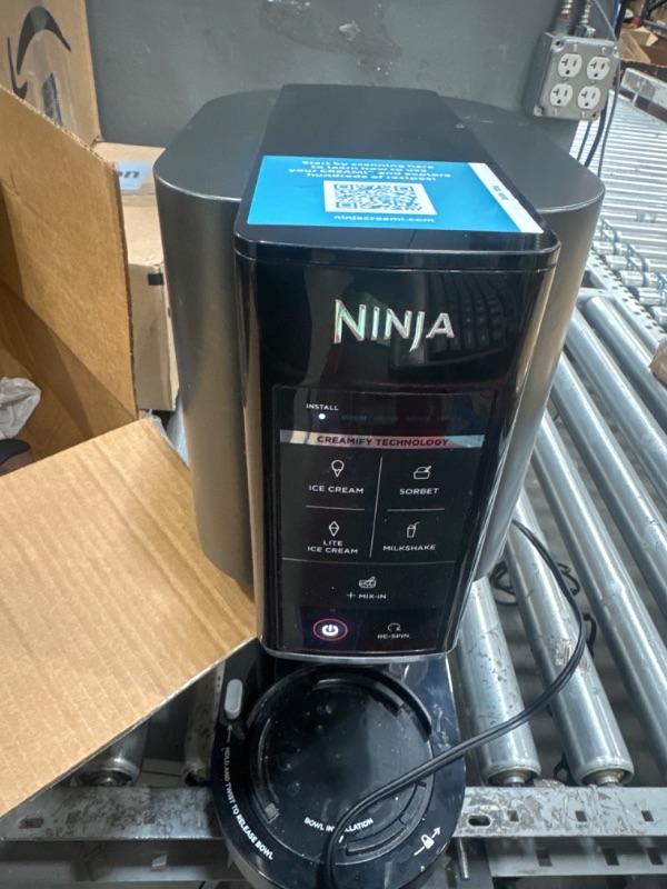 Photo 2 of *POWERS ON* Ninja NC300 CREAMi Ice Cream Maker, for Gelato, Mix-ins, Milkshakes, Sorbet, Smoothie Bowls & More, 5 One-Touch Programs, with (2) Pint Containers & Lids, Compact Size, Perfect for Kids, Silver (Renewed)