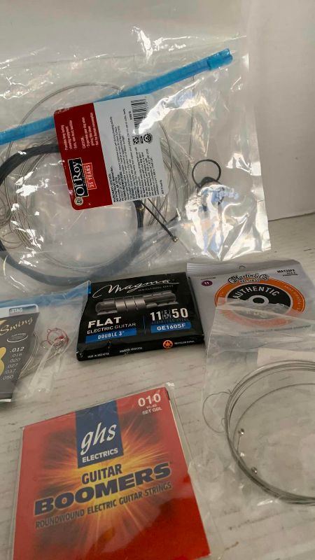 Photo 1 of ASSORTED GUITAR AND BASS STRINGS