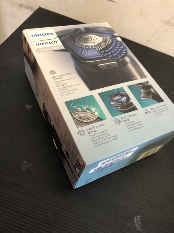 Photo 2 of Philips Norelco Shaver 7300, Rechargeable Wet & Dry Electric Shaver with SenseIQ Technology, Pop-up Trimmer, Charging Stand, Click-on Nose Trimmer, & Travel Case, S7887/92***factory sealed