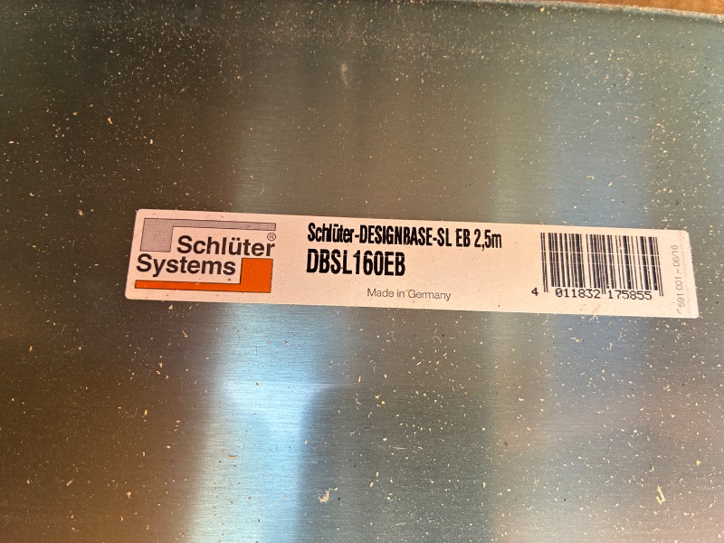 Photo 1 of SCHLUTER DESIGNBASE-SL L-SHAPE ALUMINUM TRIM BRUSHED STAINLESS STEEL FINISH 6.375” X 98.5” (10 PER CASE) READ NOTES