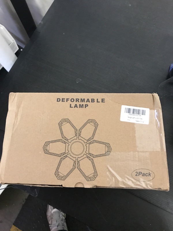 Photo 1 of TANBABY 2 Pack Garage Light Warm 150W Led Garage Lights 3000k Garage Lighting 12000LM [Equivalent] Deformable Garage Light Ceiling with 6 Panels E26/E27 Base Illuminator 360 Basement Lights for Shop