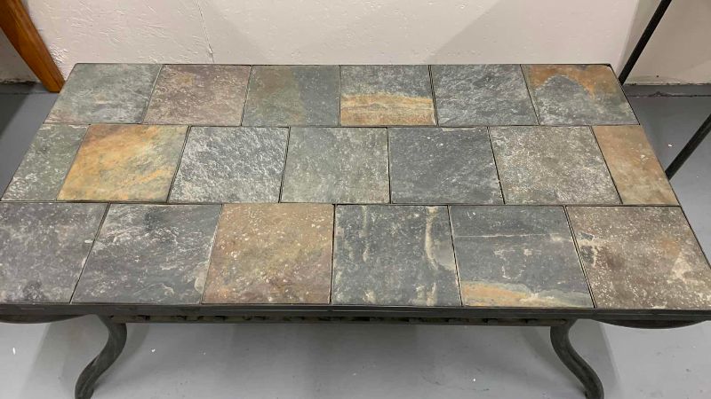 Photo 1 of SLATE SLAB STONE AND METAL PATIO COFFEE TABLE 49” X 24” H 19”