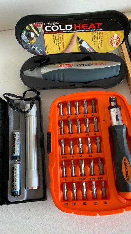Photo 1 of BLACK AND DECKER DRIVER SET, XACTO KNIFE, COLD/HEAT TOOL AND A FLASHLIGHT