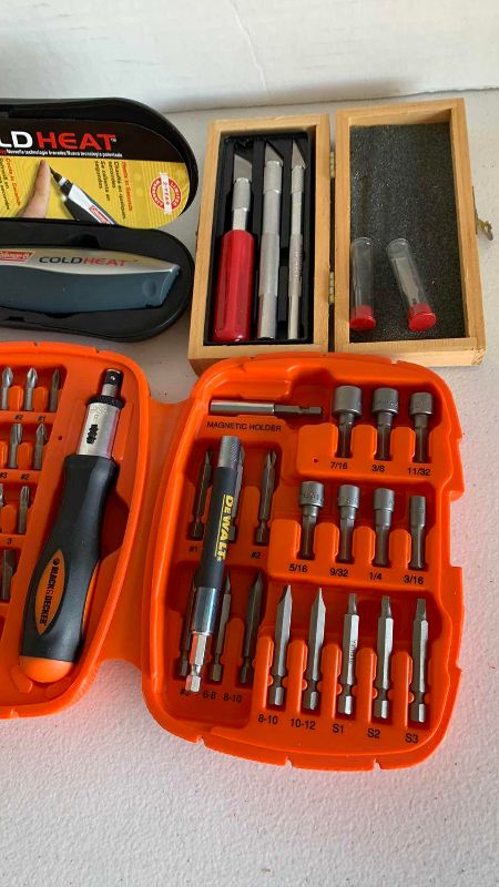 Photo 1 of BLACK AND DECKER DRIVER SET, XACTO KNIFE, COLD/HEAT TOOL AND A FLASHLIGHT