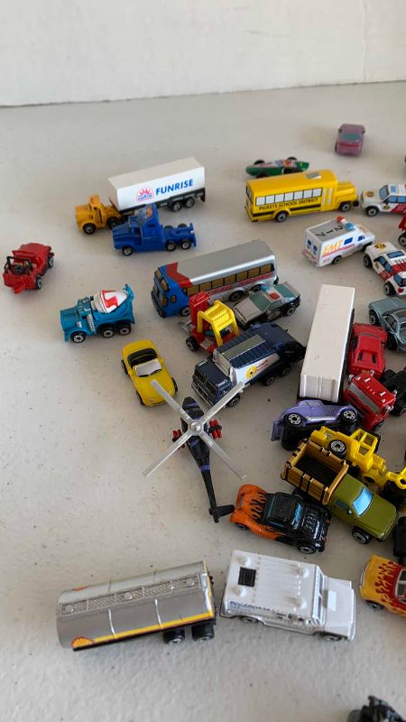 Photo 1 of VINTAGE ASSORTED MINI VEHICLES AND PEOPLE MICRO MACHINES