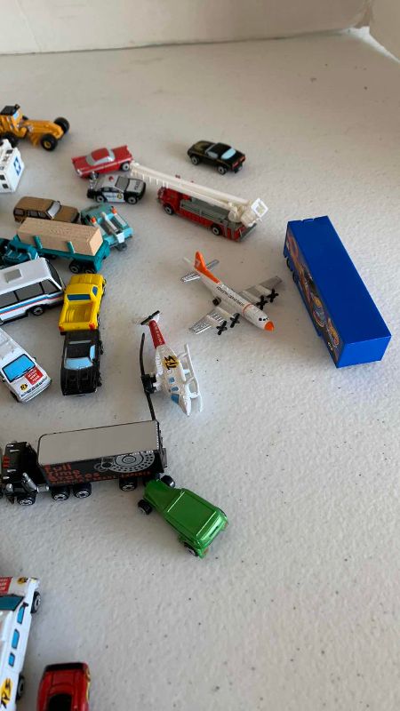 Photo 1 of VINTAGE ASSORTED MINI VEHICLES AND PEOPLE MICRO MACHINES