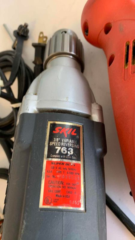 Photo 1 of MILWAUKEE TOOLS 3/8” REVERSING DRILL AND A SKIL 3/8” VARIABLE SPEED REVERSING DRILL MOTOR
