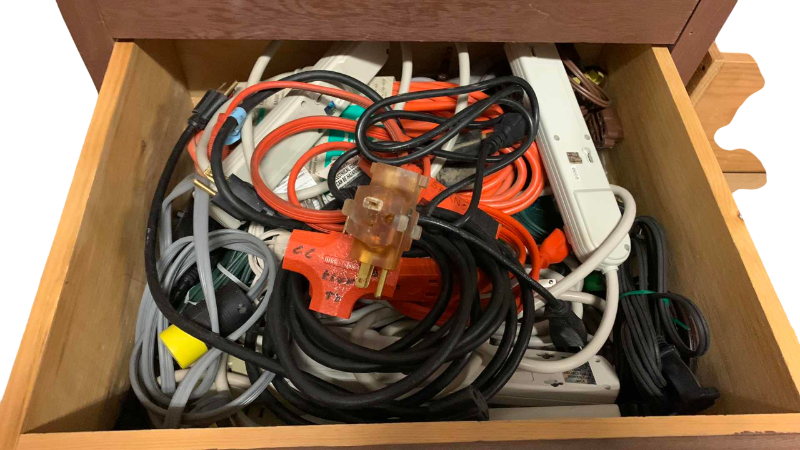 Photo 1 of CONTENTS OF DRAWER ELECTRICAL CORDS AND SURGE PROTECTORS