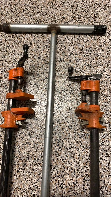 Photo 1 of 2-EXTRA LONG CLAMPS AND A WATER VALVE TURN OFF POLE