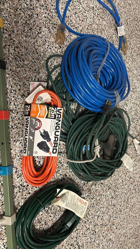 Photo 1 of ASSORTED SIZE ELECTRICAL EXTENSION CORDS AND RACK