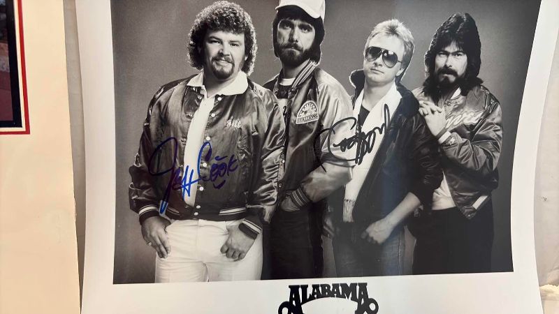 Photo 1 of AUTOGRAPHED ALBAMA COUNTRY BAND PHOTOGRAPH AND FOLDER