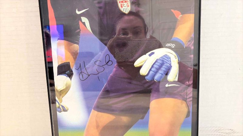 Photo 1 of AUTOGRAPHED UNITED STATES WOMEN'S SOCCER TEAM HOPE SOLO PICTURE