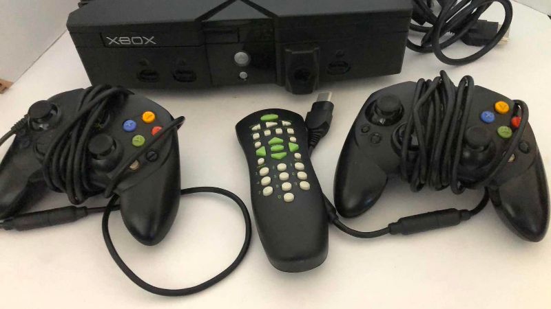 Photo 1 of XBOX GAME SYSTEM, DVD CONTROLLER AND 2 HAND CONTROLLERS