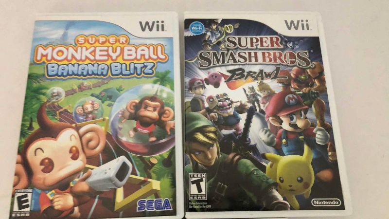Photo 1 of 3-NINTENDO WII GAMES: SUPER SMASH BROTHERS BRAWL, SUPER MONKEY BALL BANANA BLITZ AND WII FIT