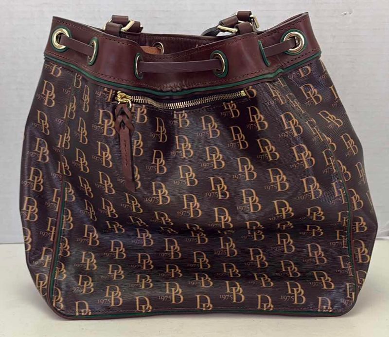 Photo 1 of DOONEY AND BURKE DESIGNER BUCKET ADJUSTABLE STRAPS AND DRAWSTRING CLOSING  WITH KEY CHAIN AND DUST COVER