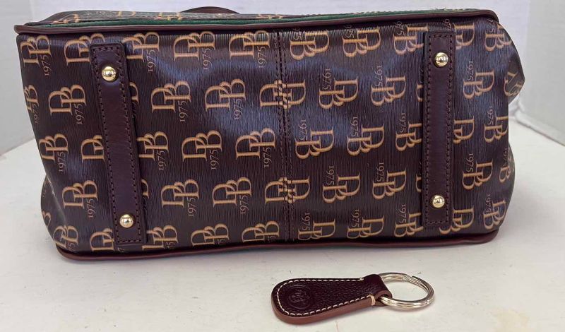 Photo 1 of DOONEY AND BURKE DESIGNER BUCKET ADJUSTABLE STRAPS AND DRAWSTRING CLOSING  WITH KEY CHAIN AND DUST COVER