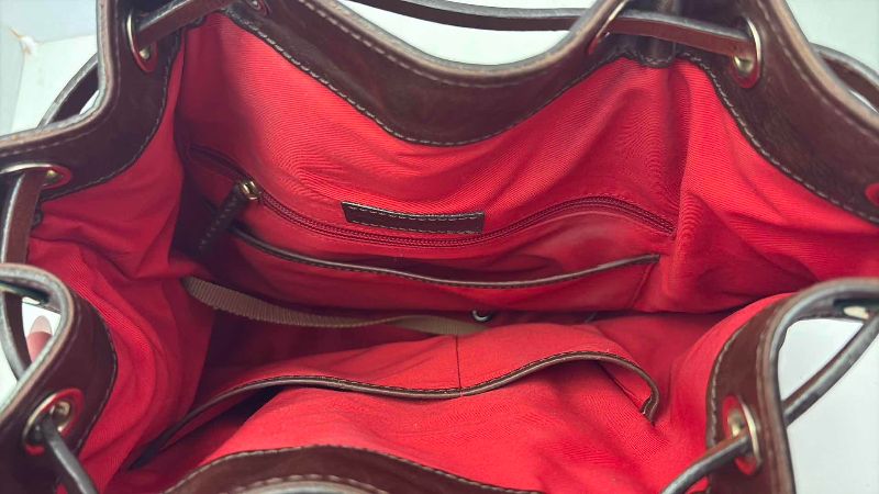 Photo 1 of DOONEY AND BURKE DESIGNER BUCKET ADJUSTABLE STRAPS AND DRAWSTRING CLOSING  WITH KEY CHAIN AND DUST COVER