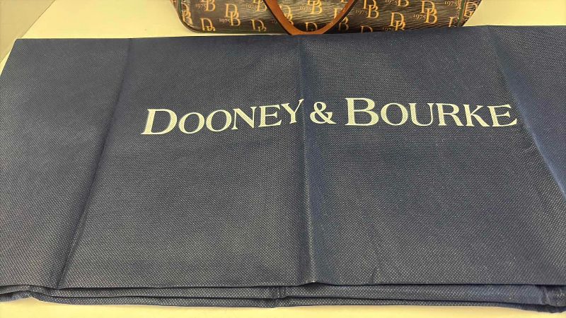 Photo 1 of DOONEY AND BURKE DESIGNER BUCKET ADJUSTABLE STRAPS AND DRAWSTRING CLOSING  WITH KEY CHAIN AND DUST COVER