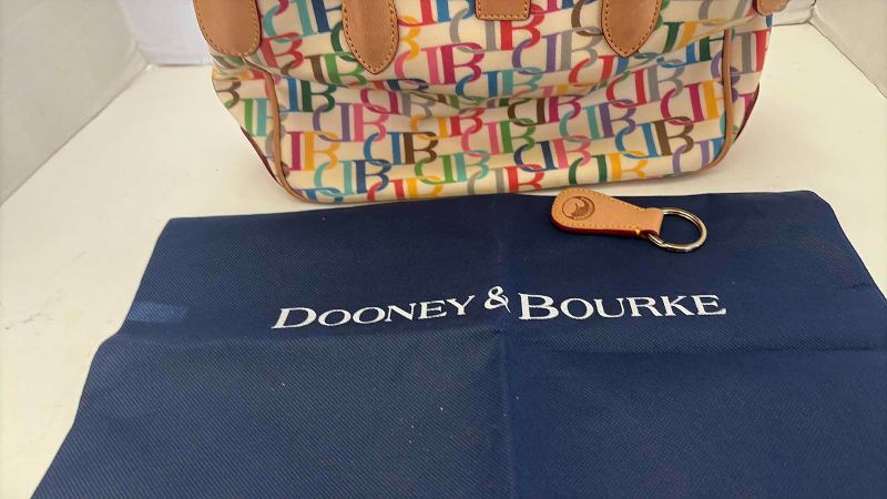 Photo 1 of VINTAGE DOONEY AND BOURKE SMALL TOTE WITH STRAP,KEY CHAIN, AND DUSTCOVER
