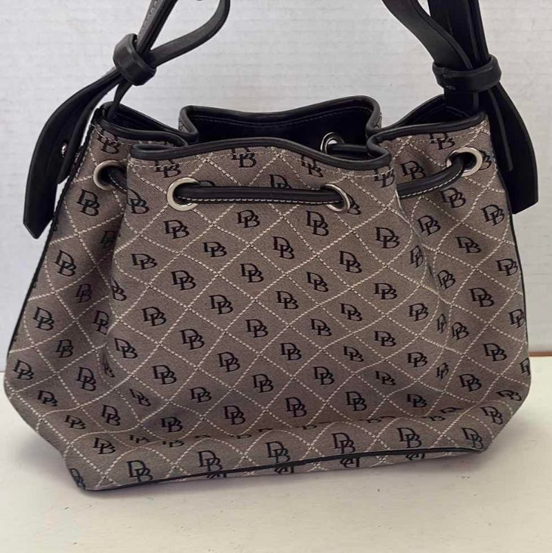 Photo 1 of VINTAGE DOONEY AND BOURKE BUCKET BAG WITH DUST COVER