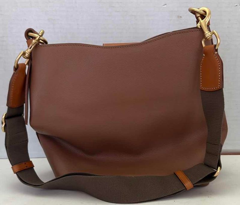 Photo 1 of DOONEY AND BOURKE LEATHER BAG IN TAN WITH ADJUSTABLE STRAP