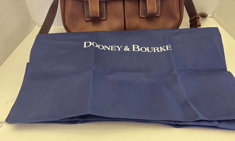 Photo 1 of DOONEY AND BOURKE LEATHER FLORENTINE SADDLE BAG WITH DUSTCOVER