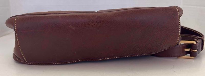 Photo 1 of DOONEY AND BOURKE LEATHER FLORENTINE SADDLE BAG WITH DUSTCOVER