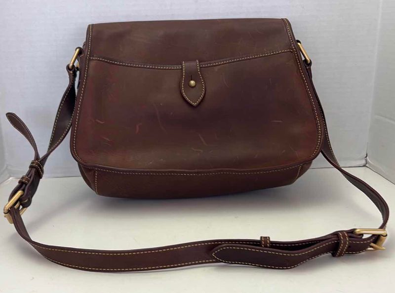 Photo 1 of DOONEY AND BOURKE LEATHER FLORENTINE SADDLE BAG WITH DUSTCOVER