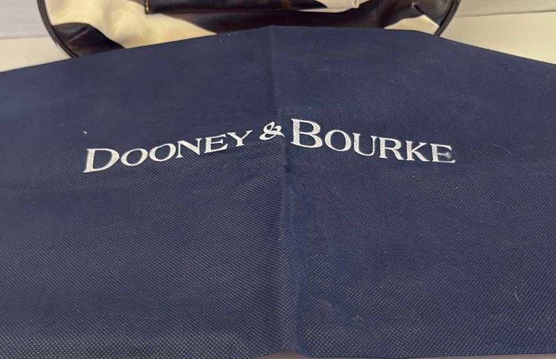 Photo 1 of DOONEY AND BOURKE ZEBRA PRINT SHOULDER BAG WITH DUSTCOVER