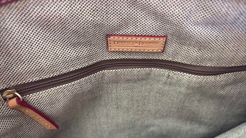 Photo 1 of DOONEY AND BOURKE CRANBERRY SHOULDER BAG WITH DUSTCOVER