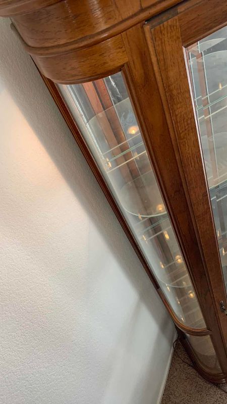 Photo 1 of VINTAGE CURVED GLASS CURIO CABINET 27” X 13” H 76