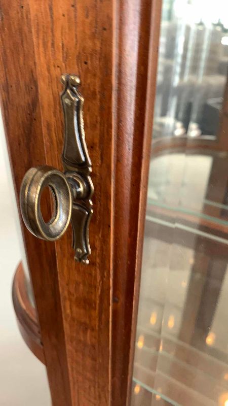 Photo 1 of VINTAGE CURVED GLASS CURIO CABINET 27” X 13” H 76