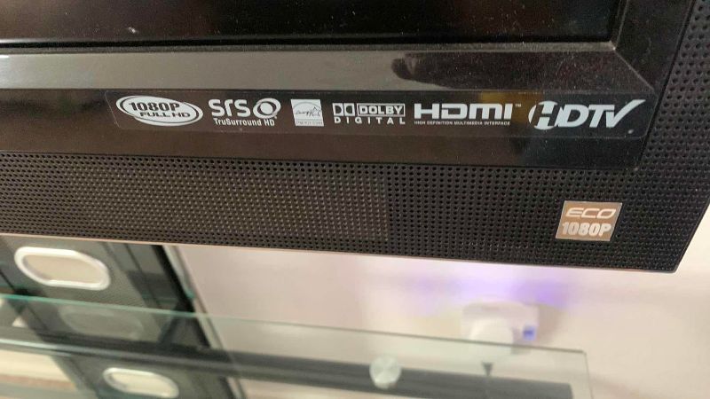 Photo 1 of VIZIO VO420E TELEVISION AND GLASS AND METAL ROTATING TELEVISION STAND 44” X 21” H 61”