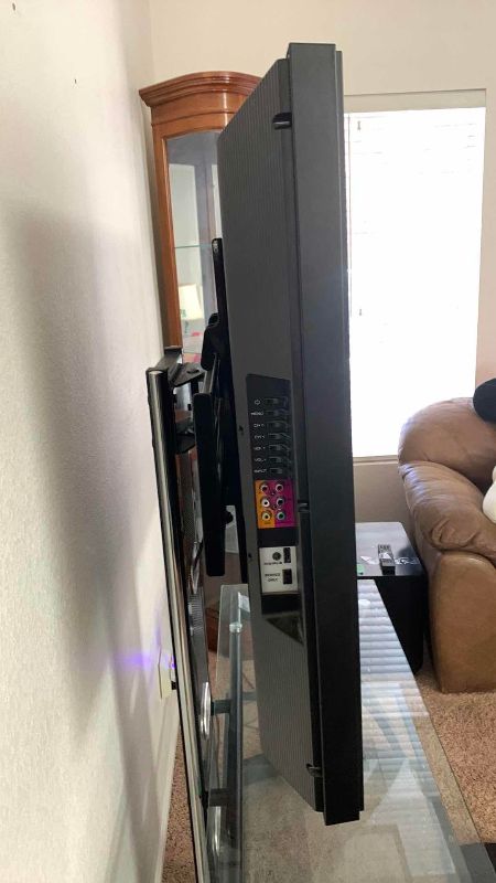 Photo 1 of VIZIO VO420E TELEVISION AND GLASS AND METAL ROTATING TELEVISION STAND 44” X 21” H 61”