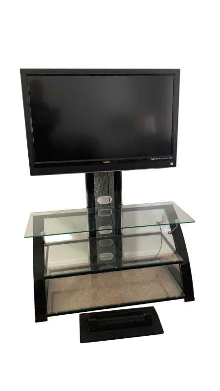 Photo 1 of VIZIO VO420E TELEVISION AND GLASS AND METAL ROTATING TELEVISION STAND 44” X 21” H 61”