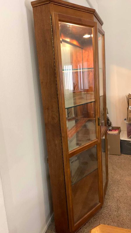 Photo 1 of WOOD AND GLASS CURIO CABINET 49” X 15” H 76”