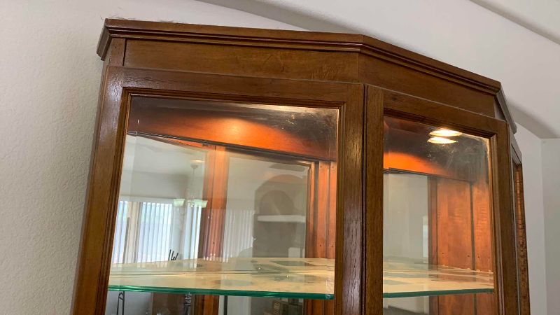 Photo 1 of WOOD AND GLASS CURIO CABINET 49” X 15” H 76”