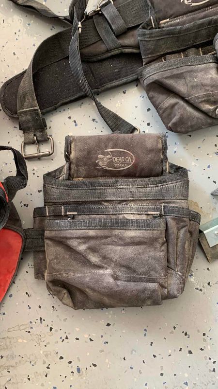 Photo 1 of CONSTRUCTION WORK BAGS AND A SQUEEGEE