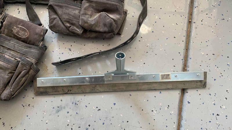 Photo 1 of CONSTRUCTION WORK BAGS AND A SQUEEGEE